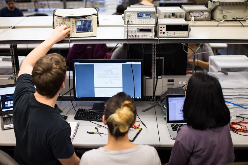 Photo of electrical engineering students at work in a lab